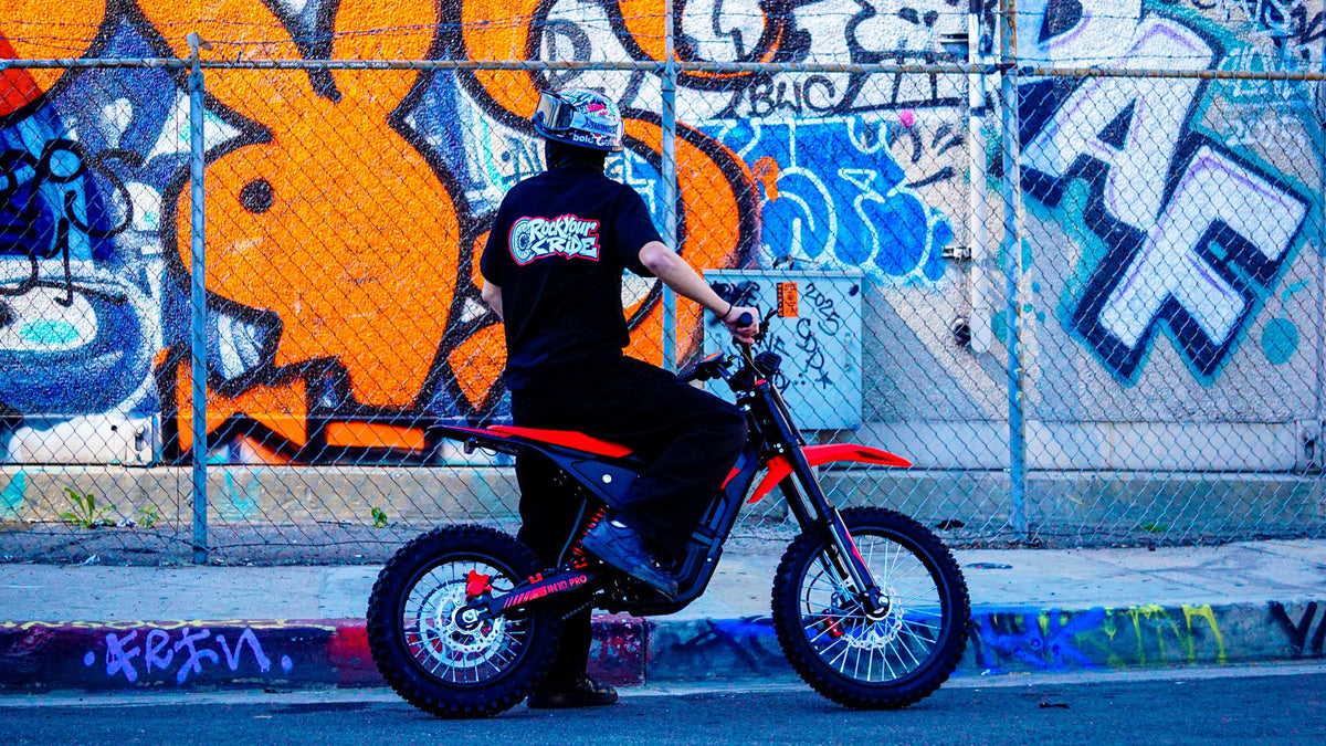 Rider lifting the front wheel of a Yozma IN 10 Pro