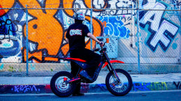 Rider lifting the front wheel of a Yozma IN 10 Pro