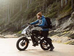 Rider on a Freego Flash F3 Pro Max on a coastal road