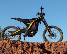 Natkie N1 on a red dirt bank against a blue sky
