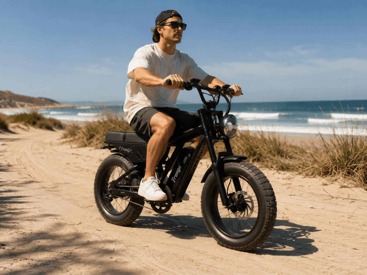 Rider on a Freego Shotgun Lite F0 on a sandy beach road