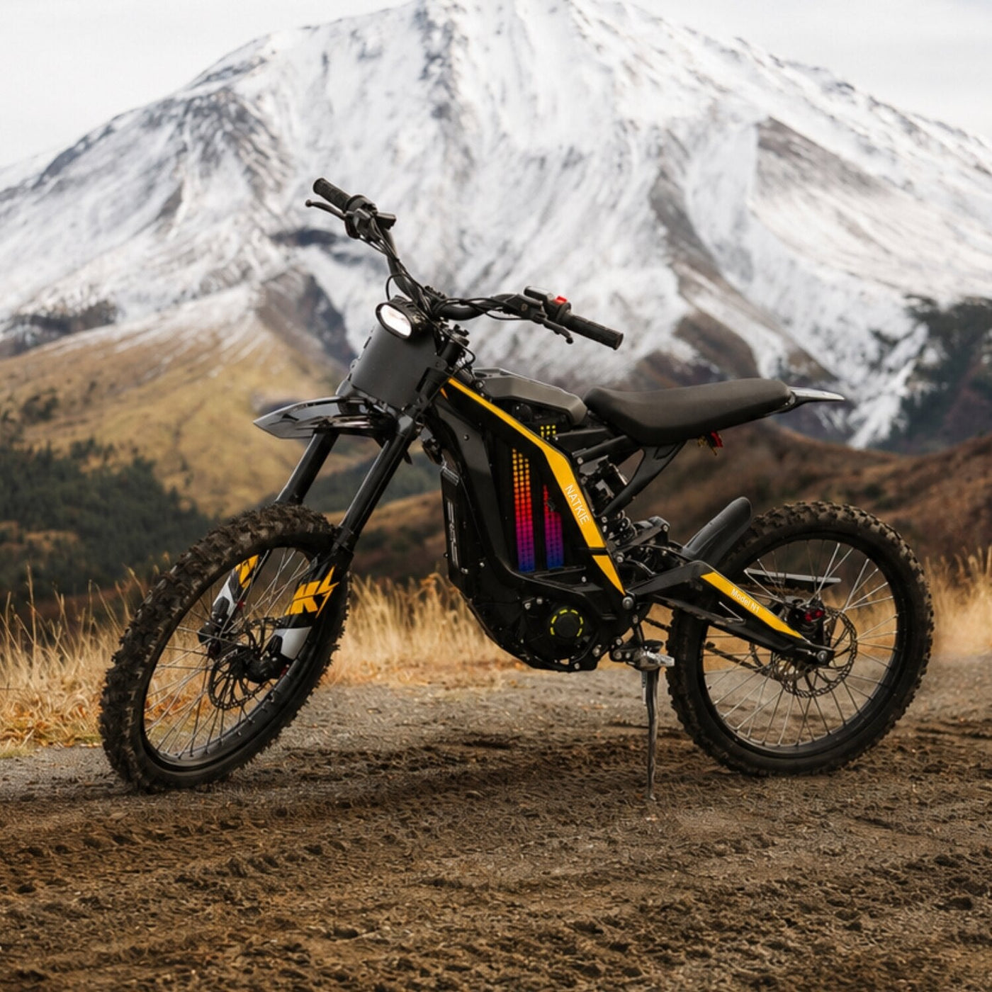 Natkie N1 parked below a snow-capped mountain
