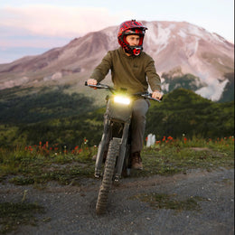 Freego Nova 4 ridden on a mountain trail with the headlight on