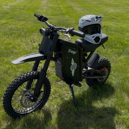 Freego X0 parked on grass with a helmet on the seat