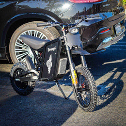 Freego X0 beside a car, showing scale