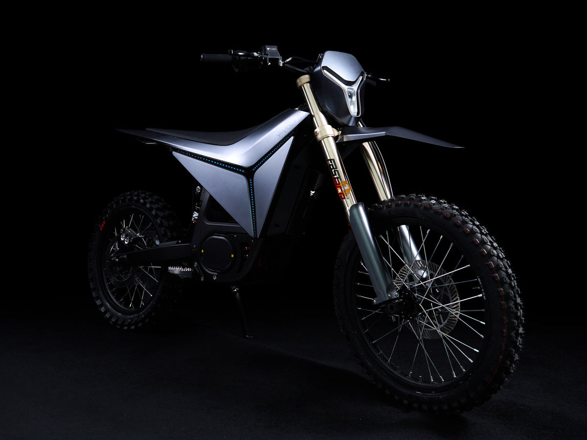 Y-VOLT Surge V in Black, front three-quarter on the stand