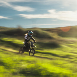Rider on a 78 Forged Phase I across open ground